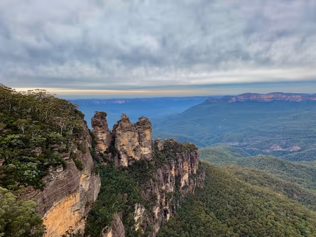 The Three Sisters in the Blue Mountains and an overcast sky.