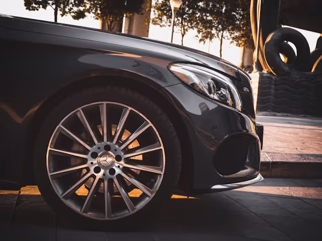 Close-up of a luxury black Mercedes-Benz wheel.
