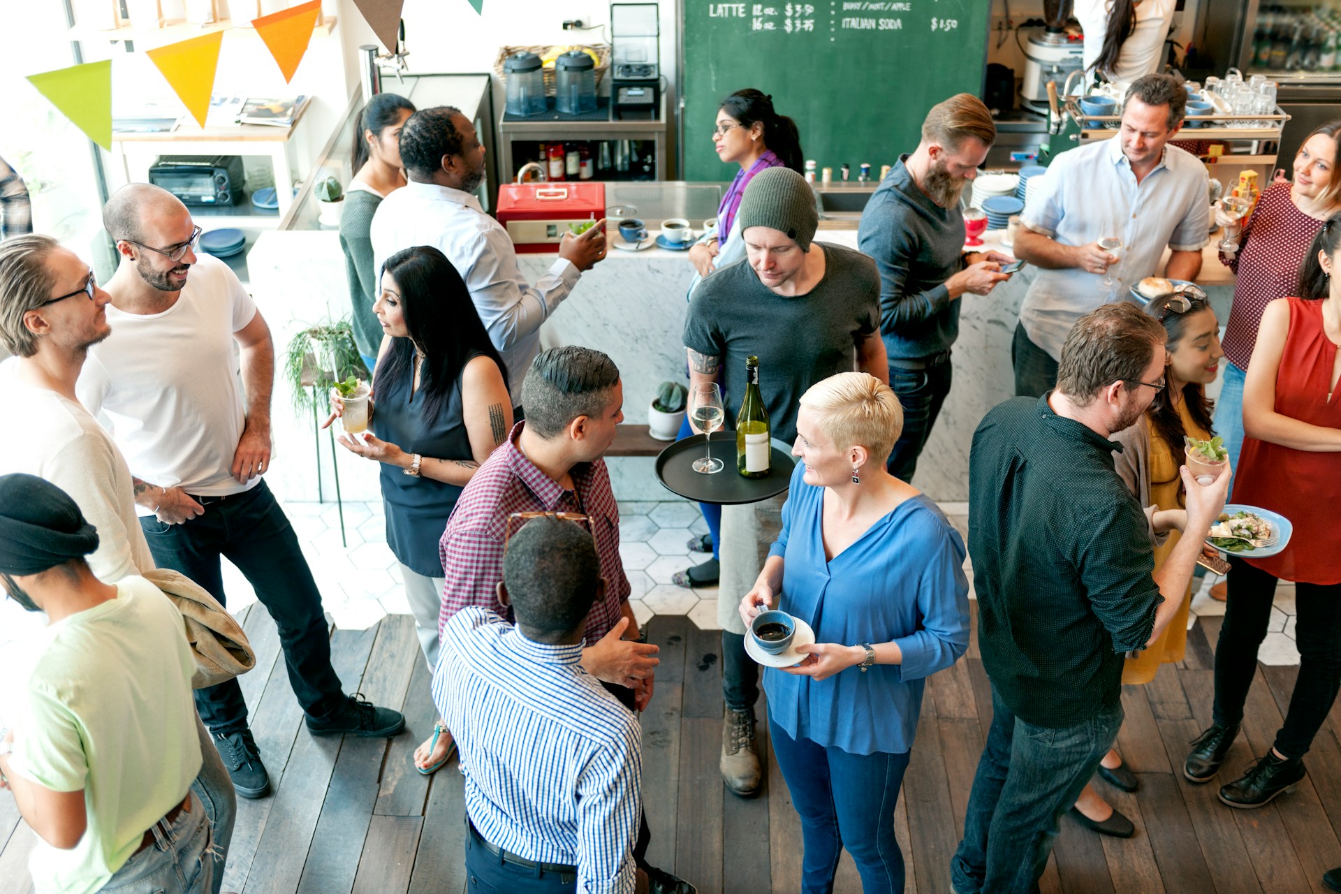Colleagues mingling and chatting at a corporate offsite gathering.