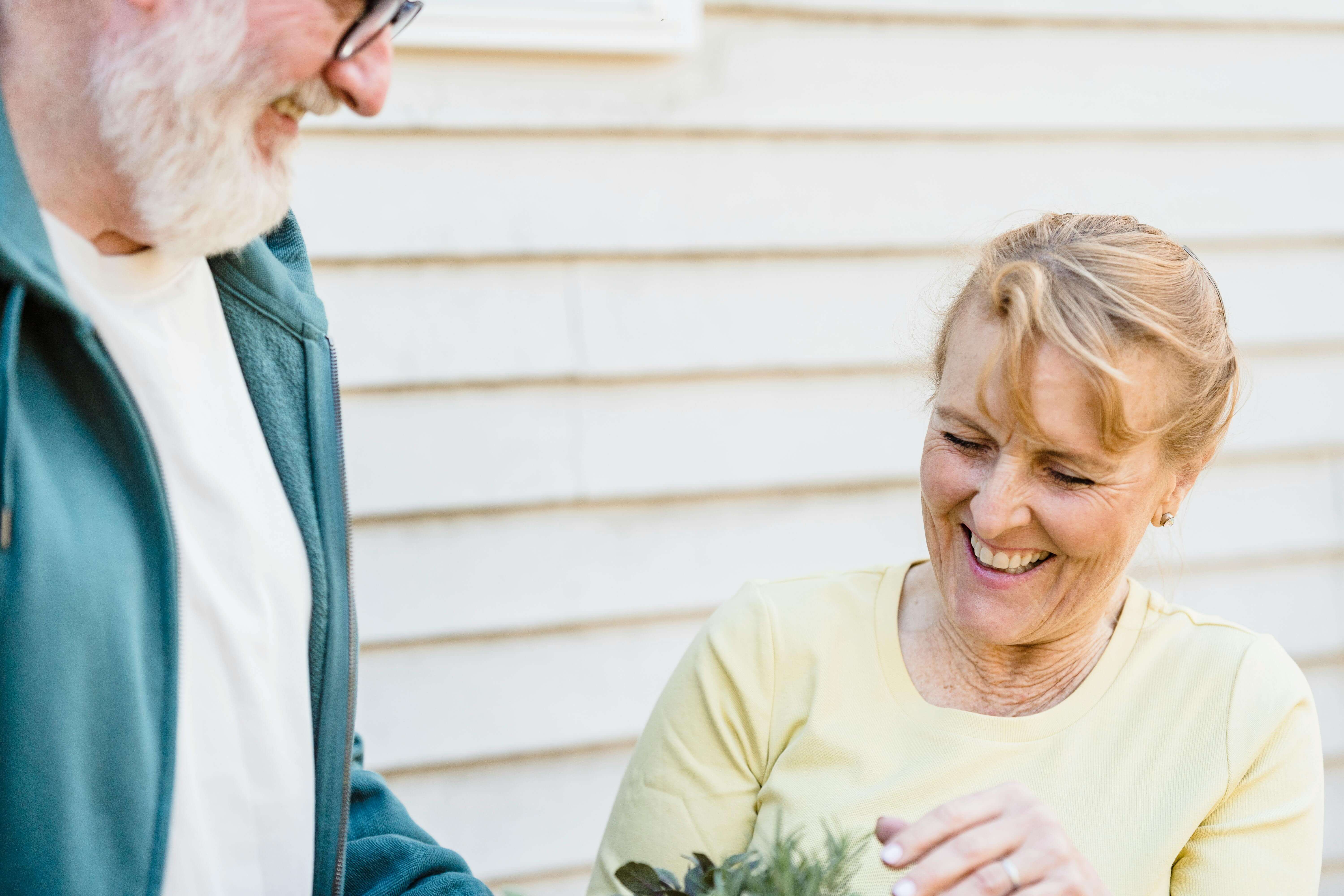 An older man and woman smiling