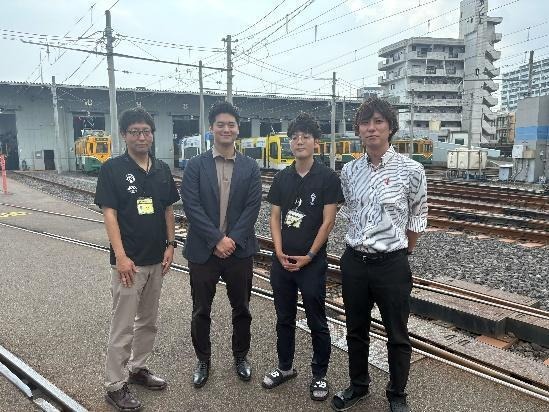 A group of men standing on a train trackAI-generated content may be incorrect.