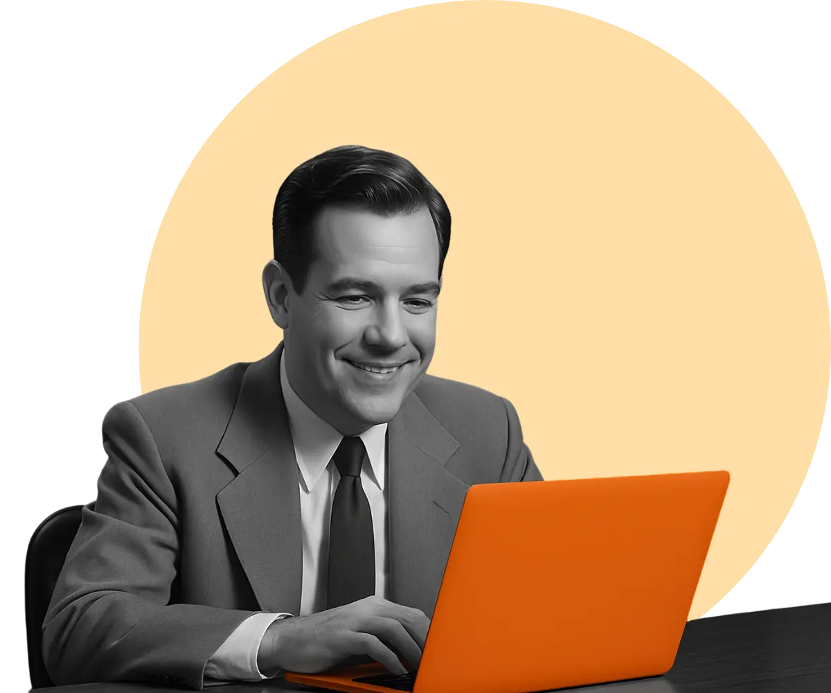 business man happily working on his laptop