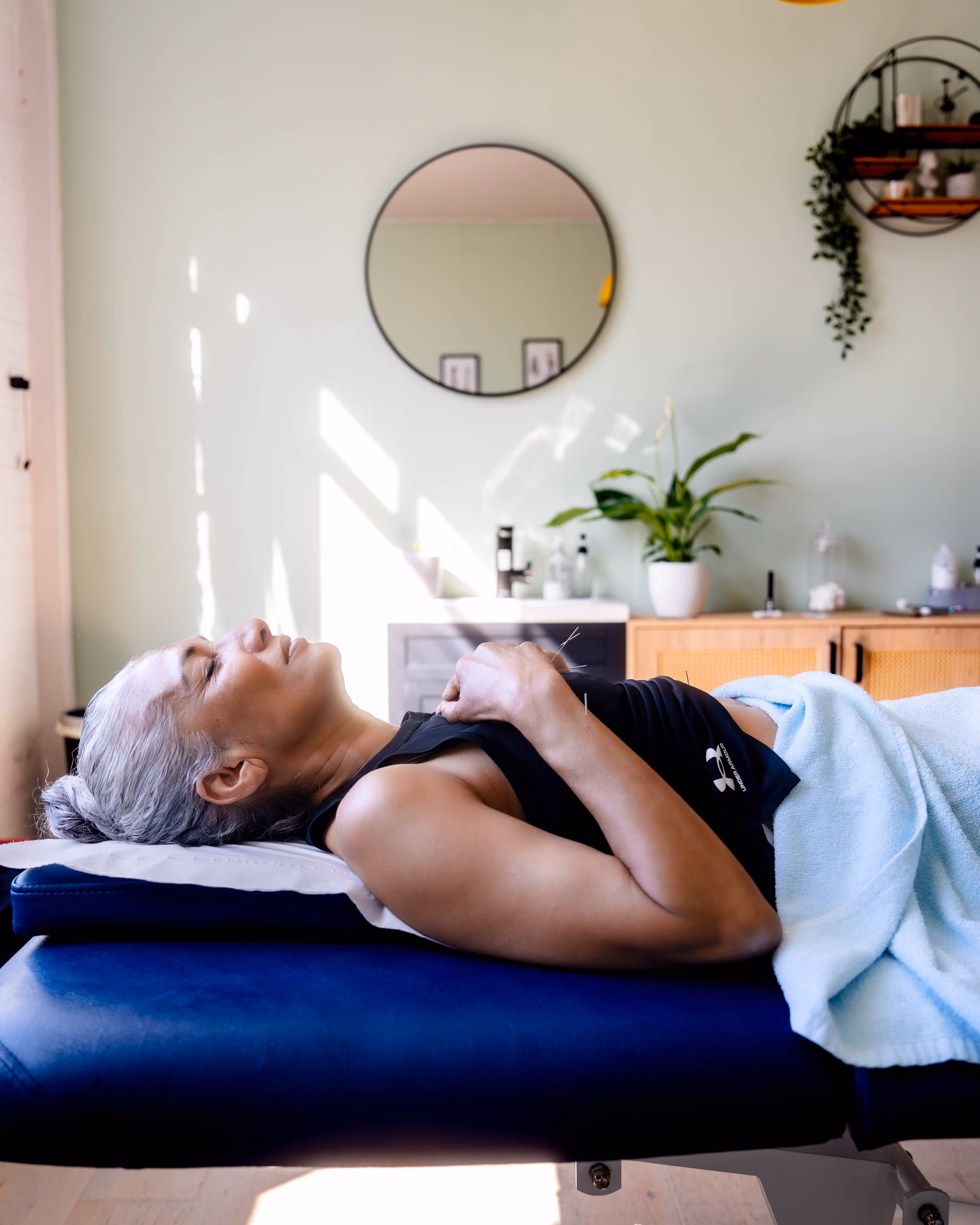 A woman receiving a deep tissue massage.