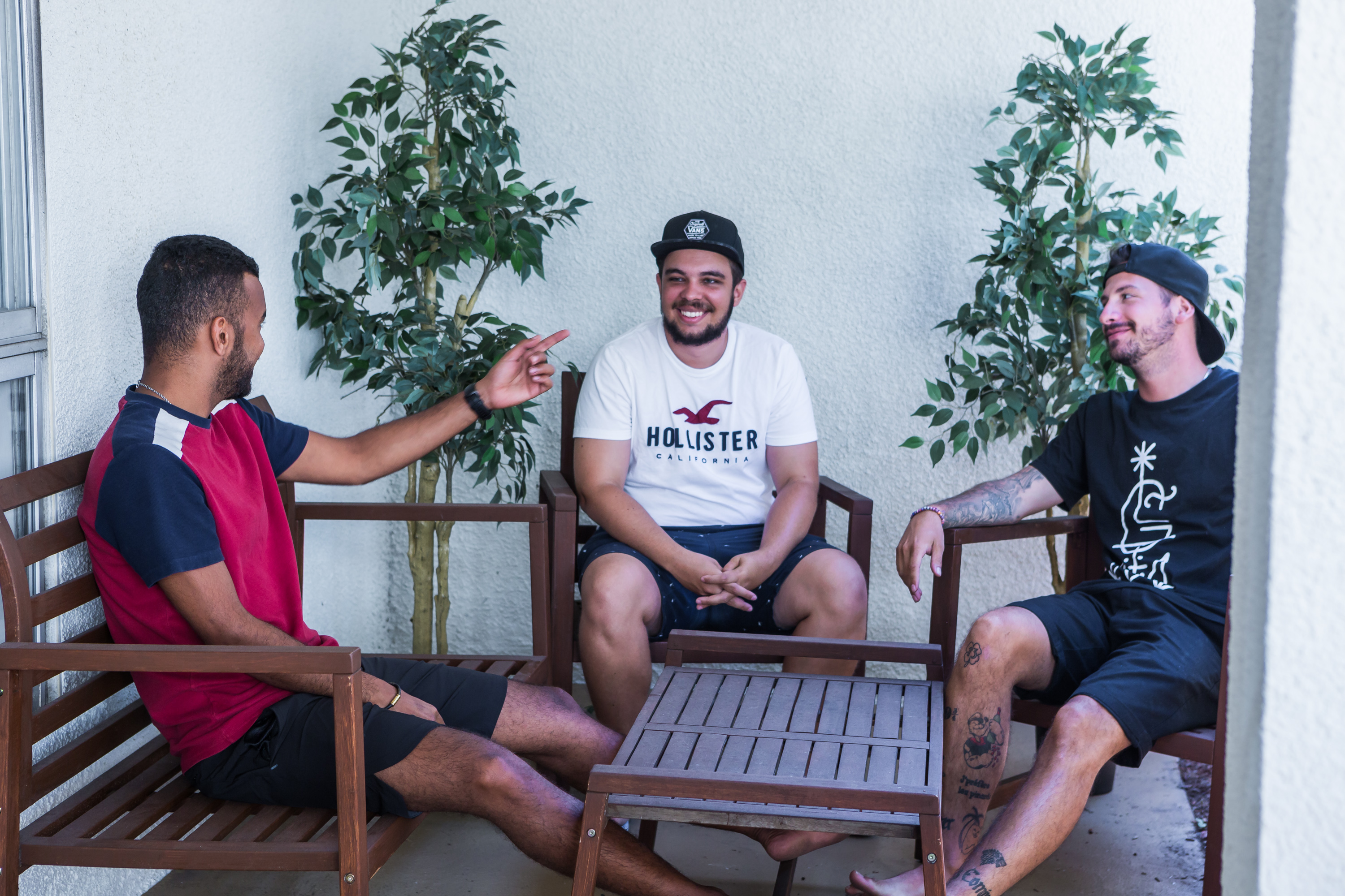 CEL students having a laugh and sharing stories while relaxing on the balcony of one of our CEL Shared Apartments Superior in San Diego Pacific Beach