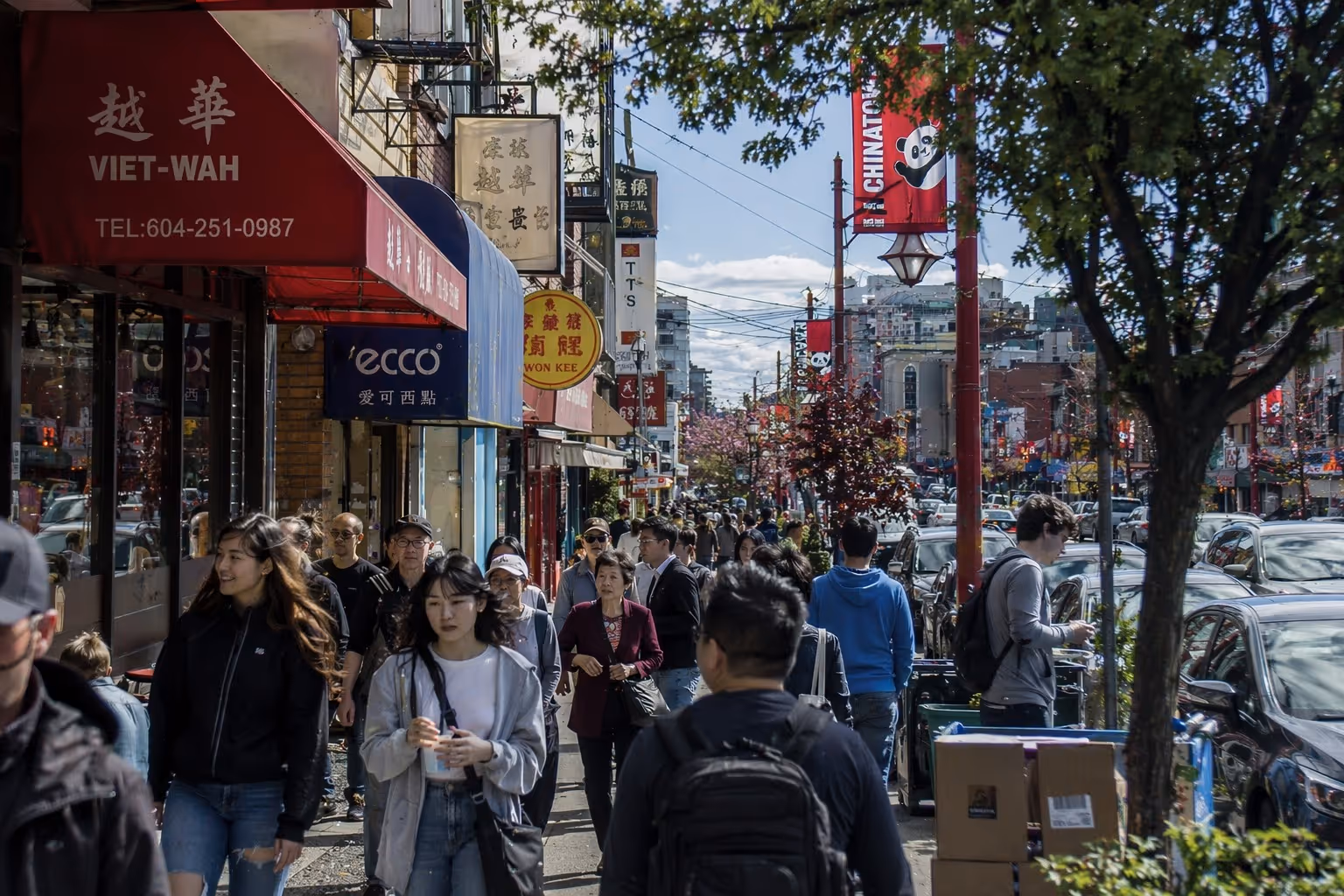 A busy Vancouver street showing the city's multicultural character, where over half of Metro Vancouver residents identify as a visible minority
