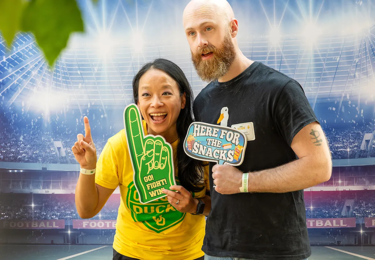 A woman and man pose for a fun photo.