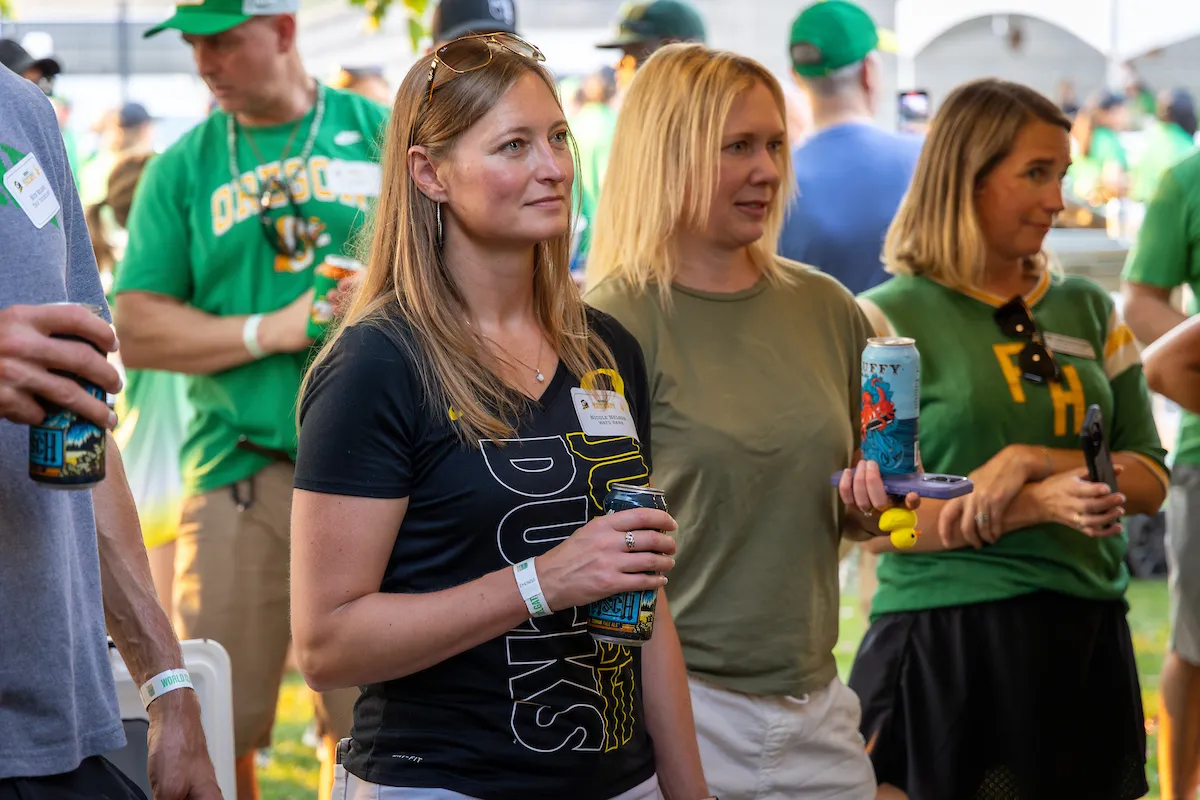Attendees listening to someone address the crowd at the event