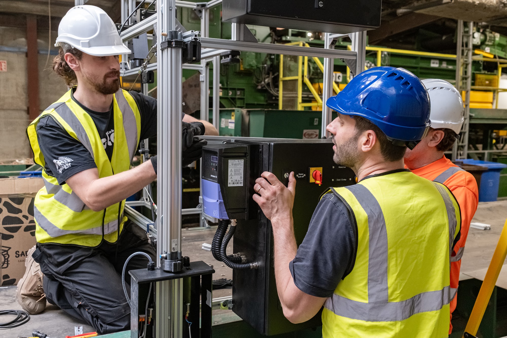 Sorted engineers fitting the SortBot control cabinet at Mulleadys