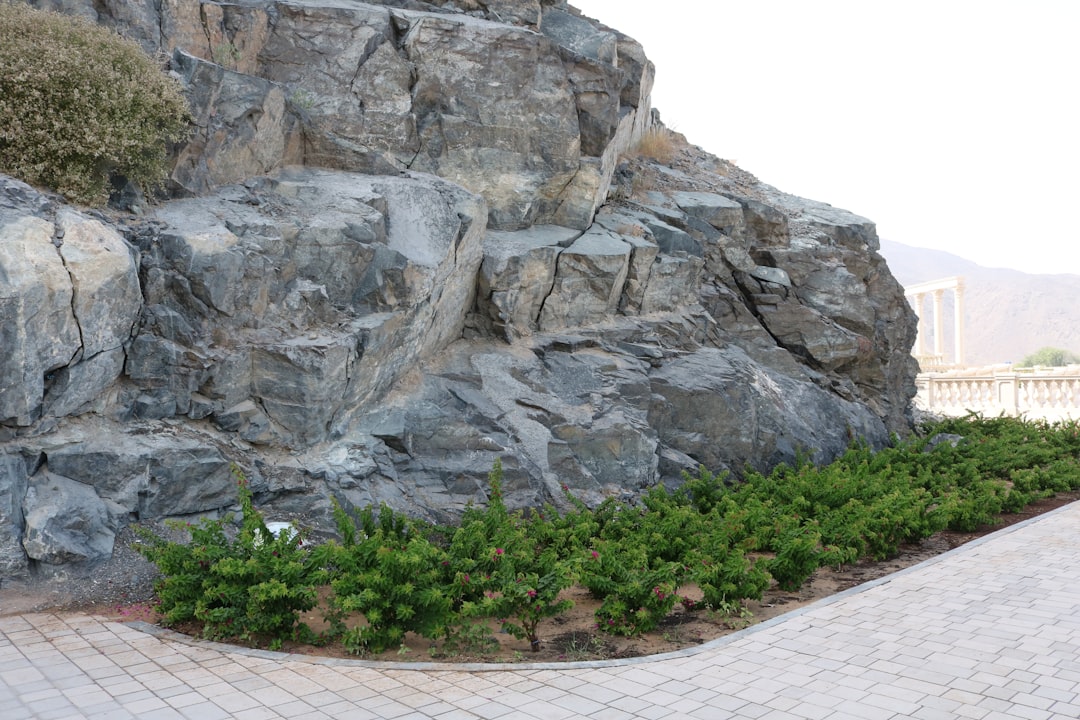 A professionally constructed rock revetment protecting a waterfront property in Southampton or West Hampton, showcasing expert craftsmanship and durability - rock revetment