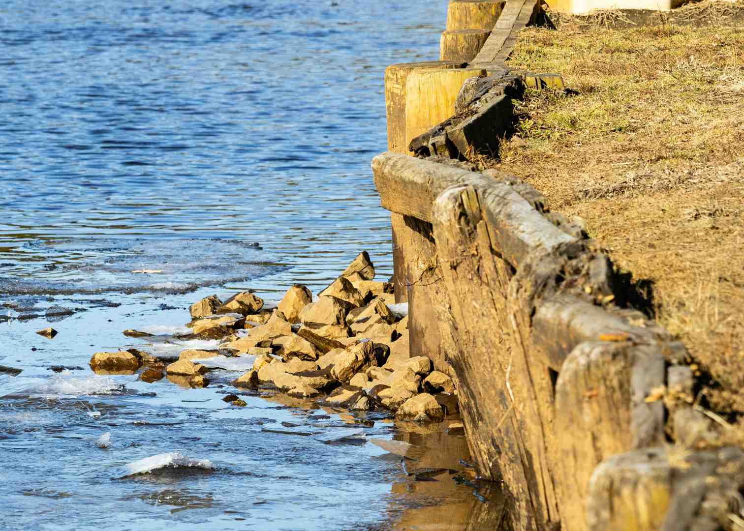 Professionally installed French drain outlet near a bulkhead on Long Island - flood water management solutions Professionally installed French drain outlet near a bulkhead on Long Island - flood water management solutions