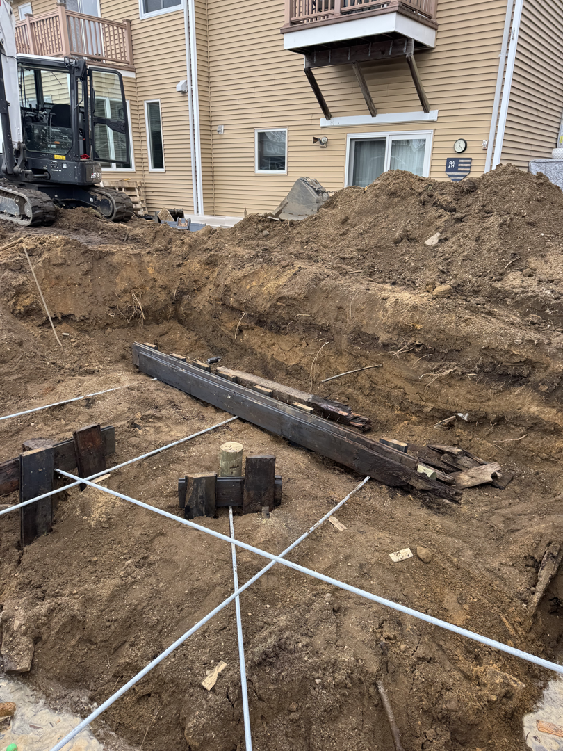 Complex retaining wall foundation and drainage system under construction - retaining walls Suffolk County Complex retaining wall foundation and drainage system under construction - retaining walls Suffolk County
