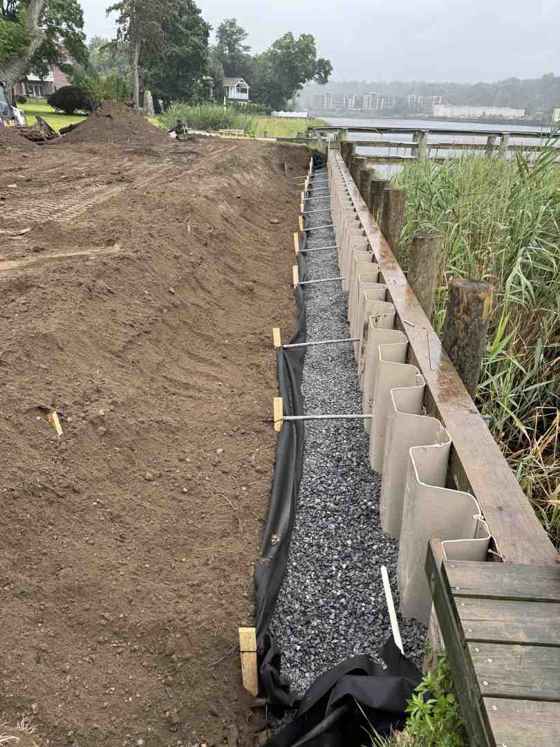 marine-grade concrete being poured for a new bulkhead cap - bulkhead cap repair