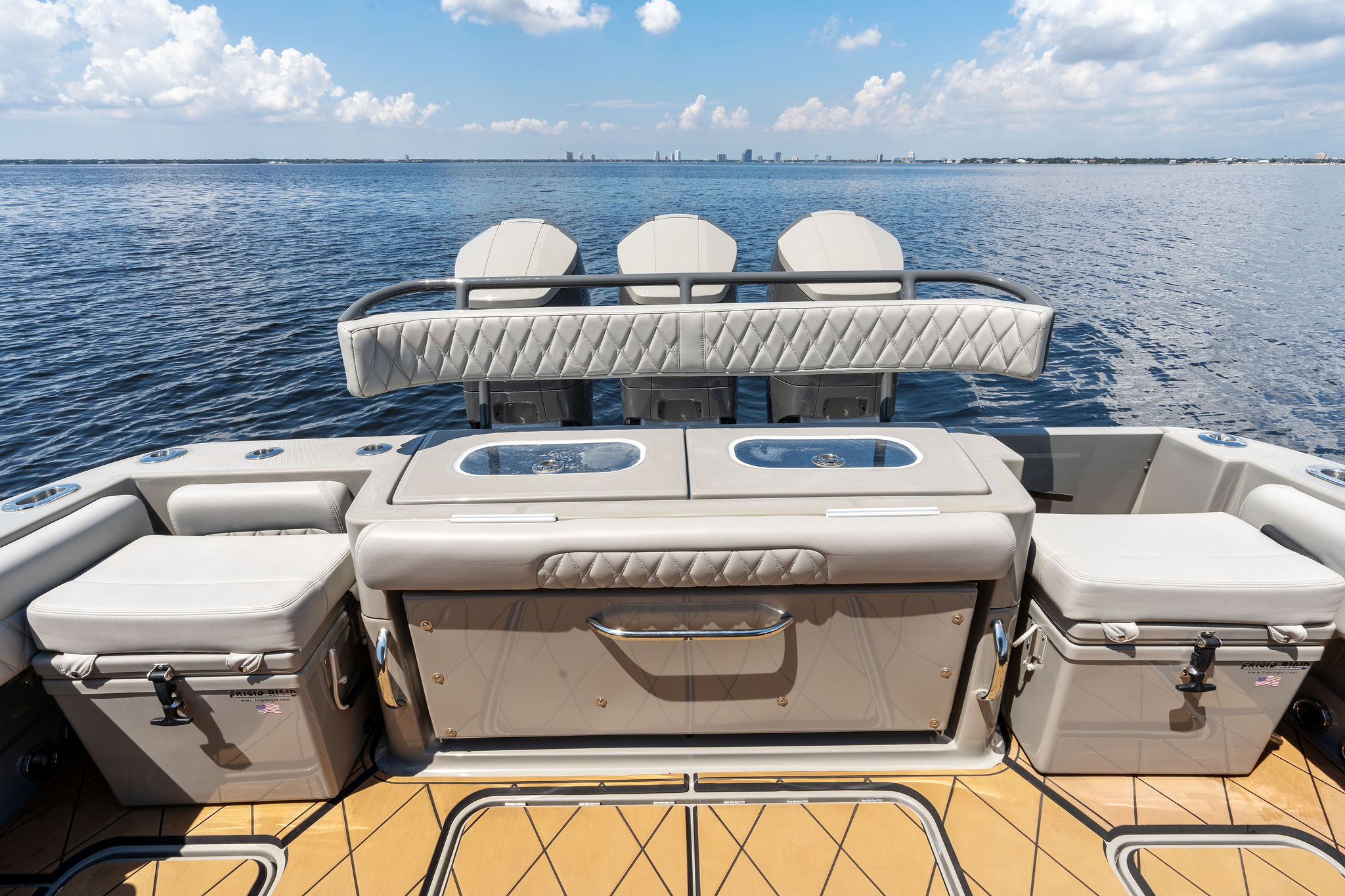 2023 HCB 42 Lujo boat interior with luxurious seating and storage, overlooking calm waters.