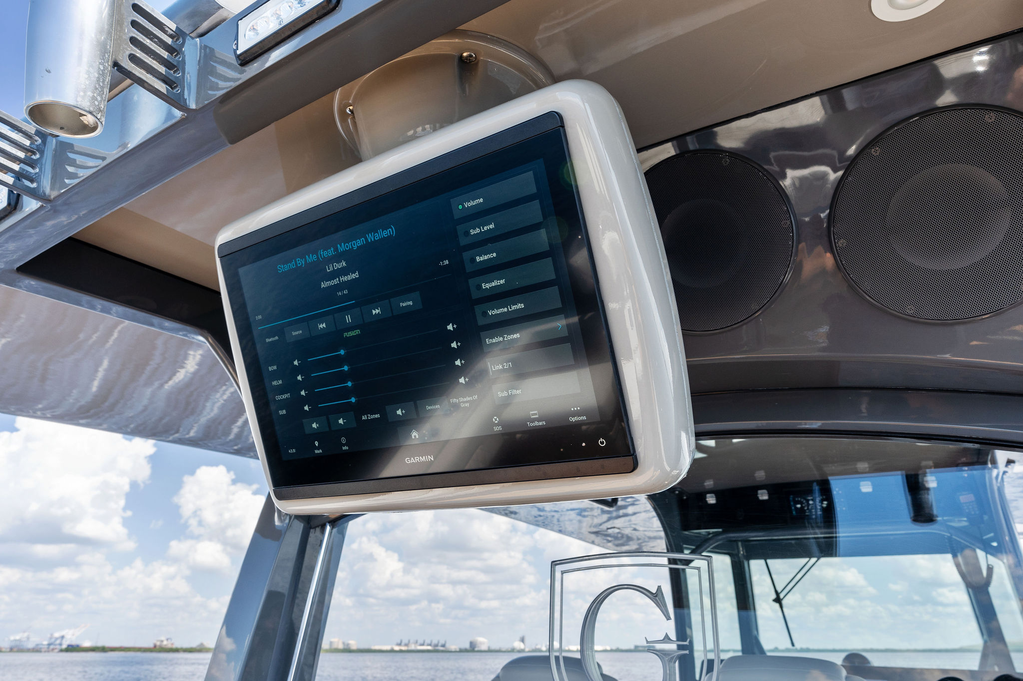 Touchscreen display on 2023 HCB 42 Lujo boat, showing audio controls.