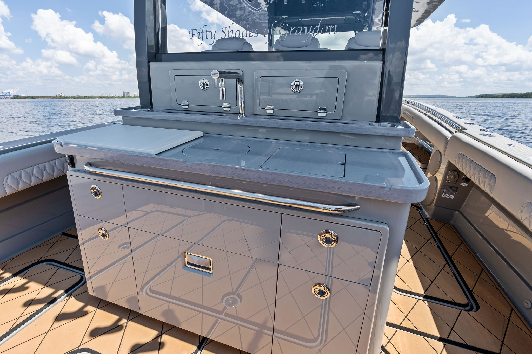 2023 HCB 42 Lujo boat interior with sleek cabinetry and ocean view.