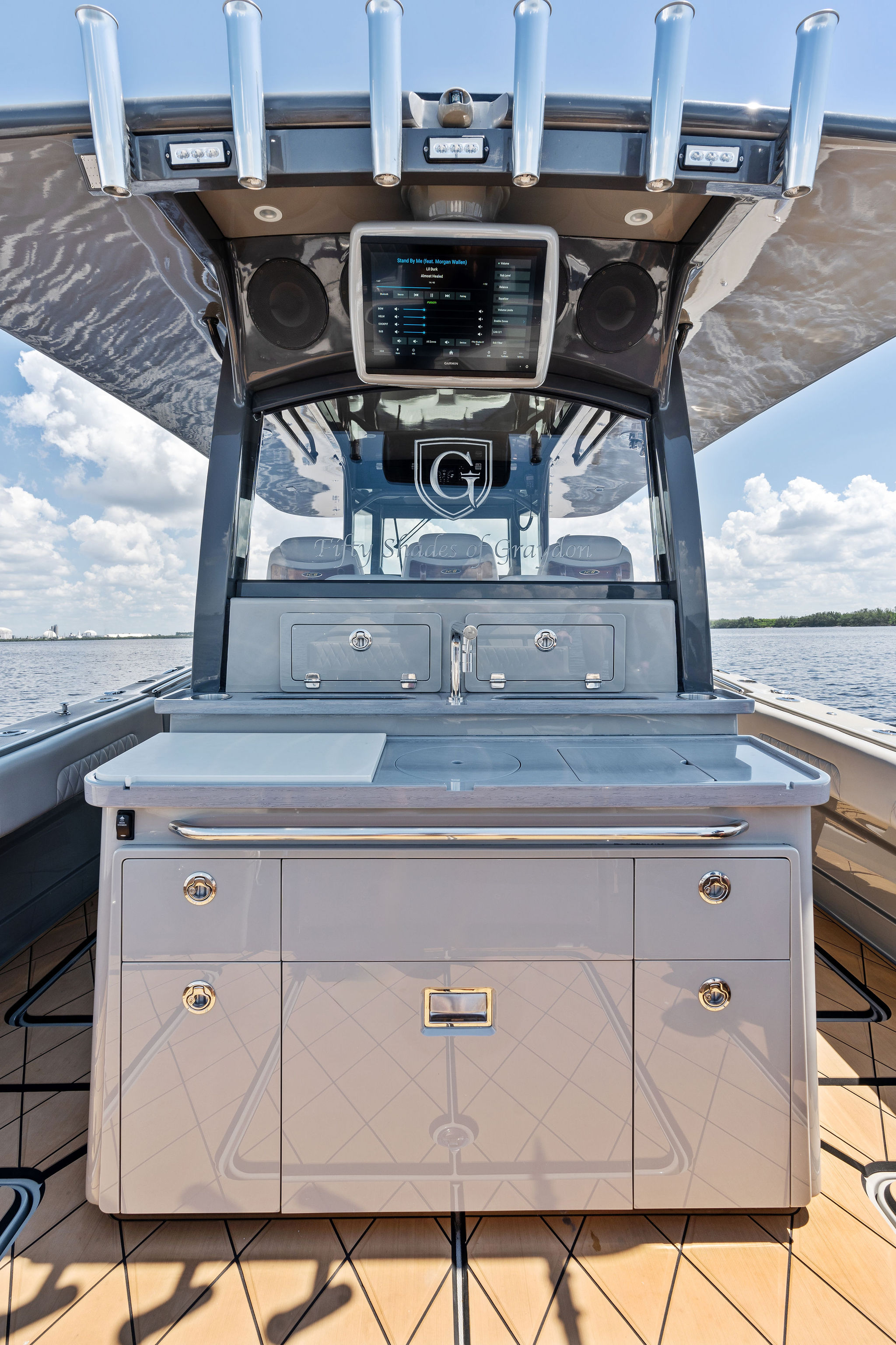 2023 HCB 42 Lujo boat interior with sleek cabinetry and advanced navigation system.
