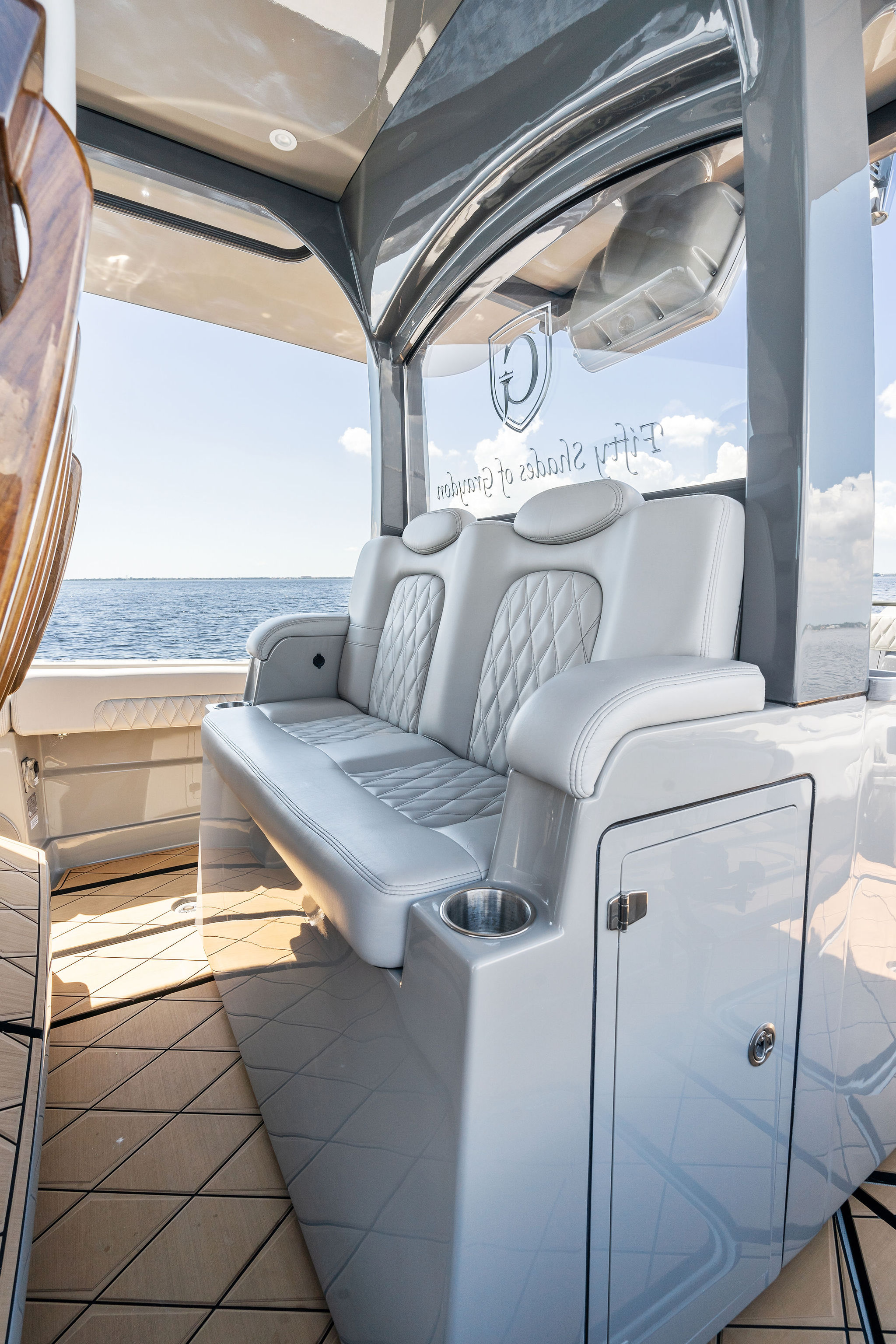 Luxurious seating on 2023 HCB 42 Lujo boat with ocean view.