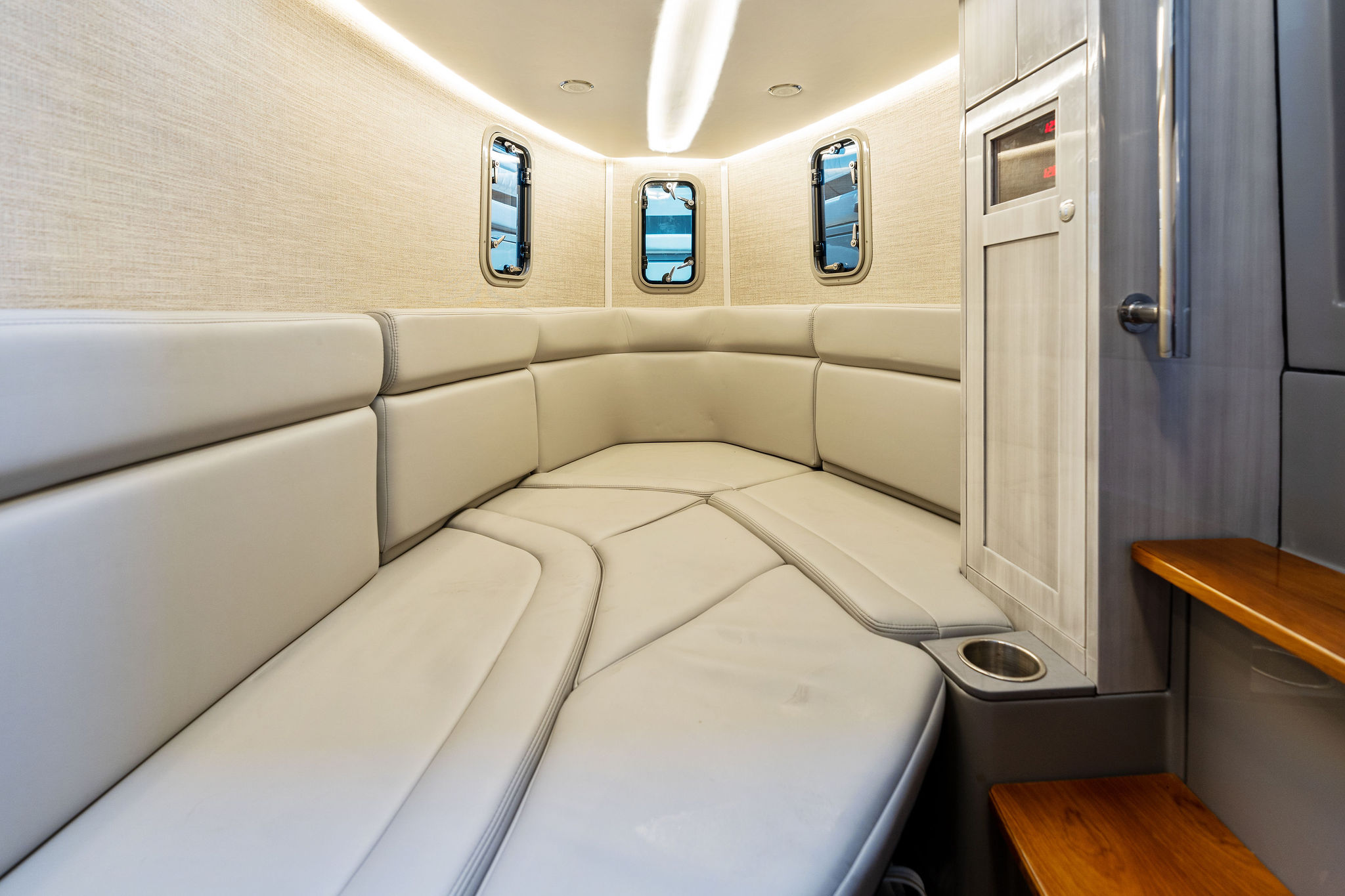 Luxurious interior of 2023 HCB 42 Lujo boat with plush seating and modern design.