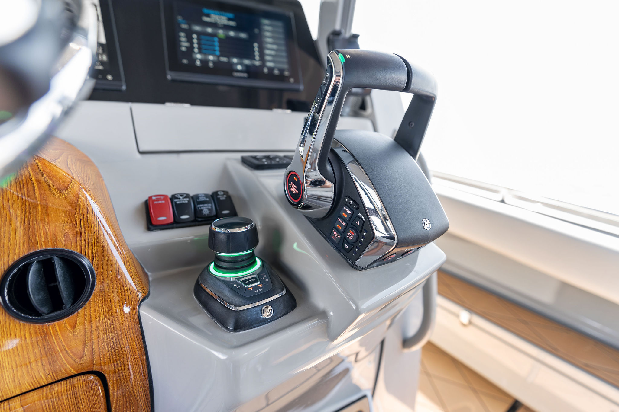 Control panel of 2023 HCB 42 Lujo boat with joystick and throttle.