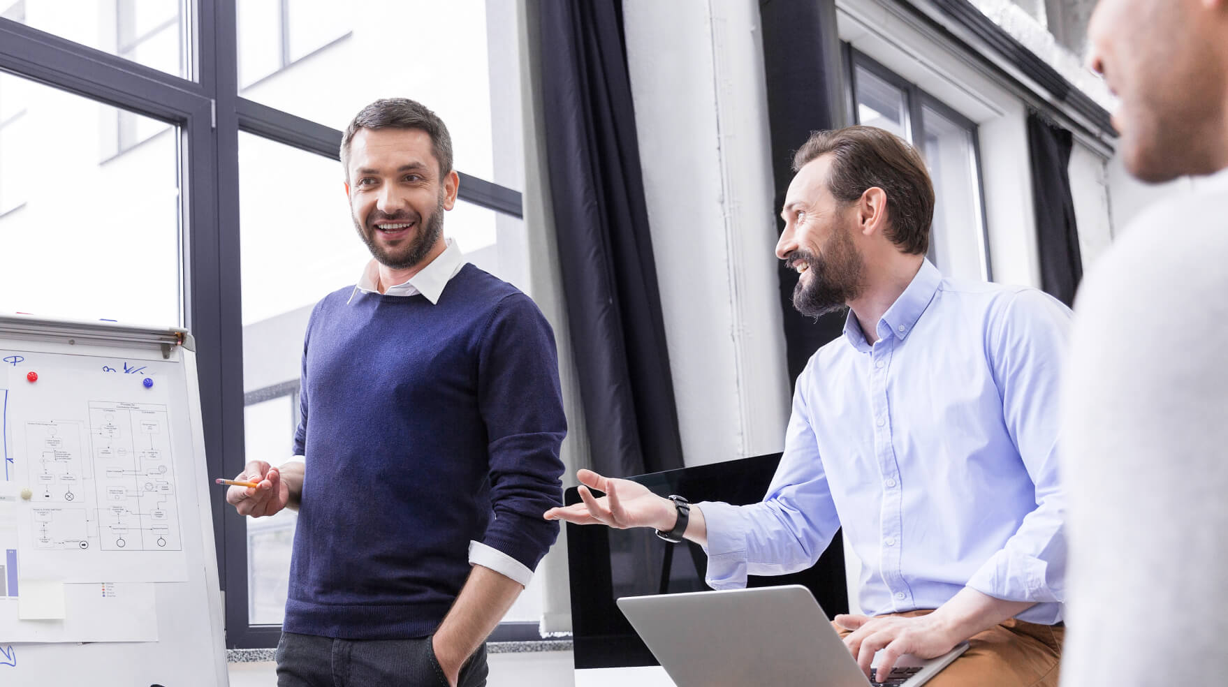 Three businessman at a meeting