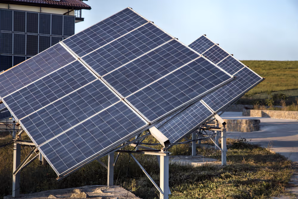 A slanted solar panel setup on the ground