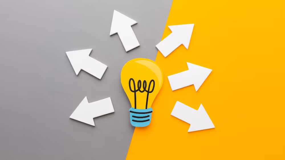 A light bulb with arrow directions