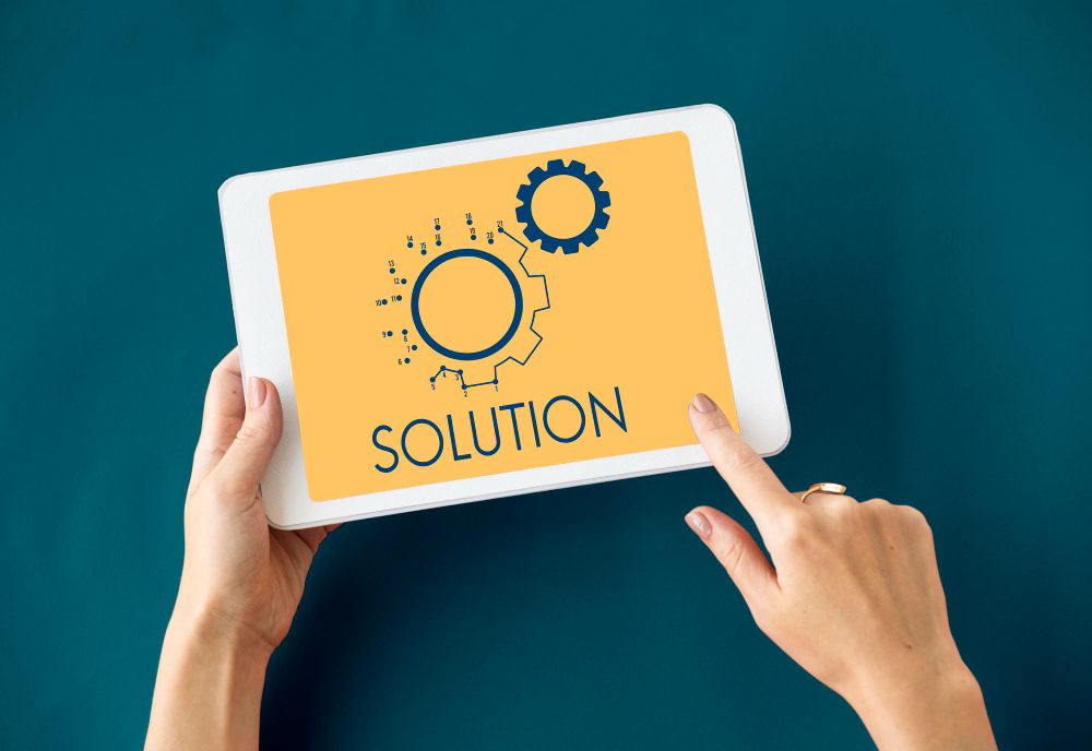 A tablet showing the word solution