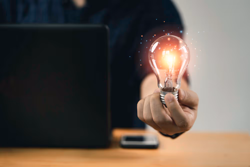 A light bulb with light being handed