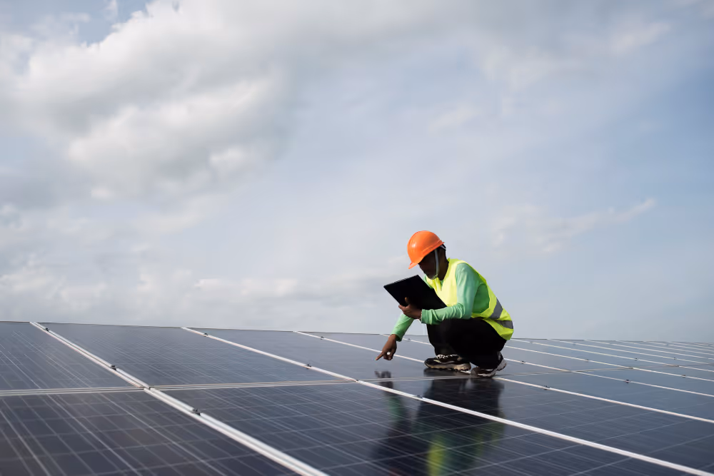 Technician having an inspection on solar panels