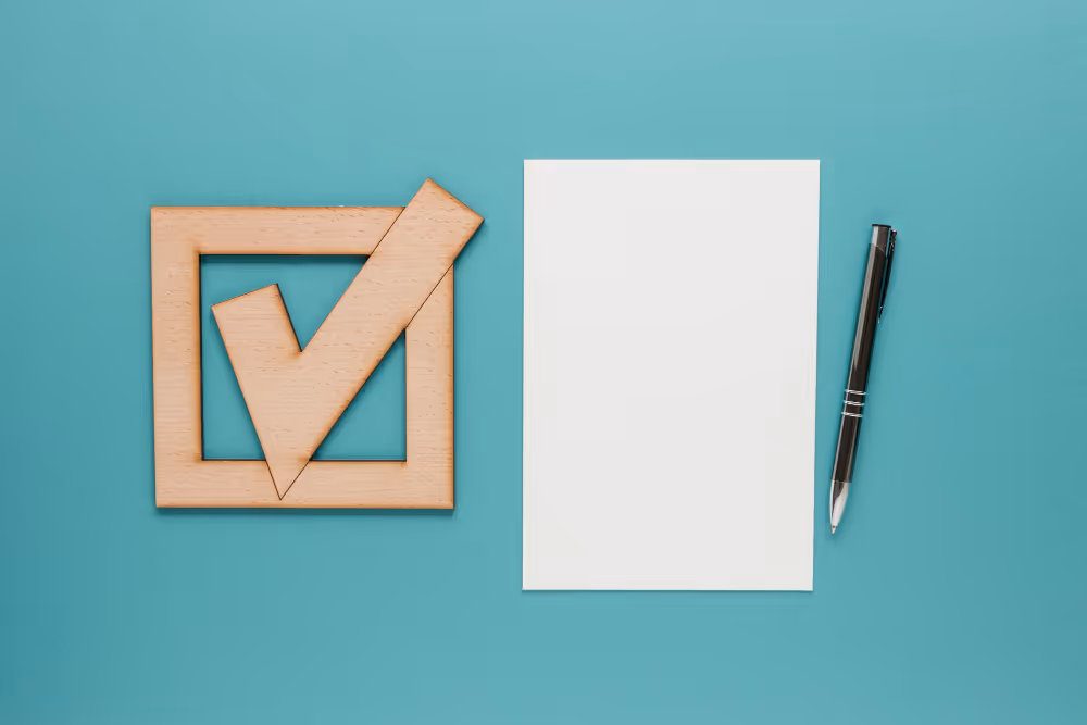 A check box next to a permit and pen