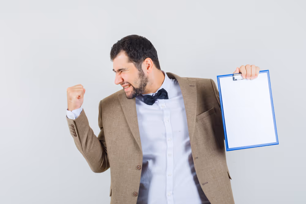 A man clenching fist like he succeed on a permit approval