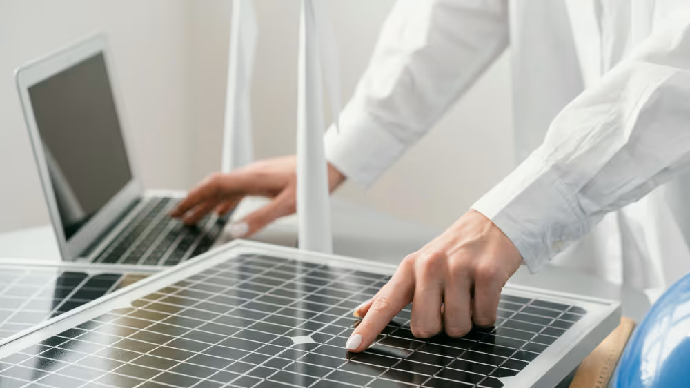 A man checking the solar panel status on a laptop