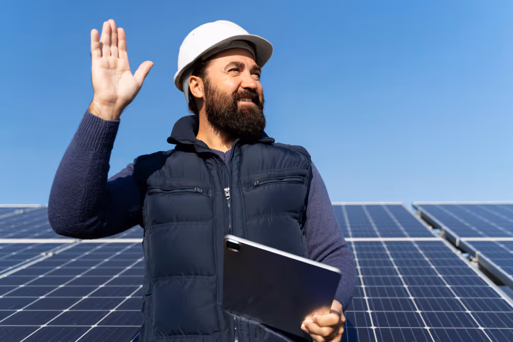 An engineer waving his hand on the solar farm