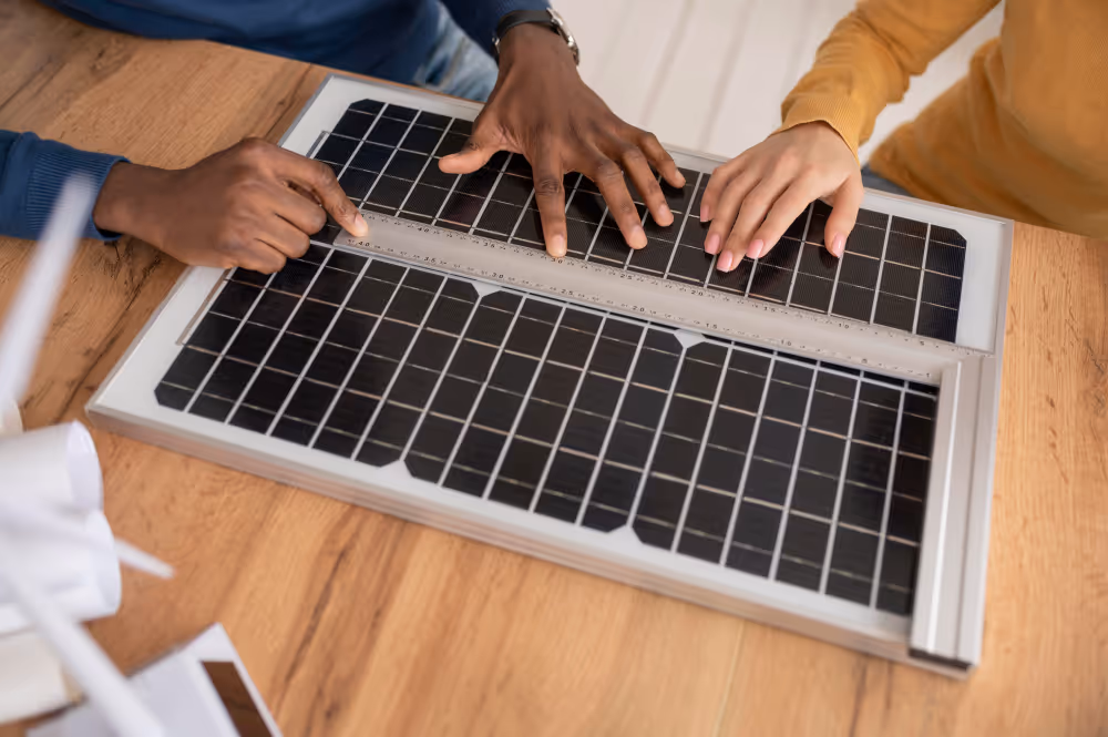 Two people discussion about solar panel on the table