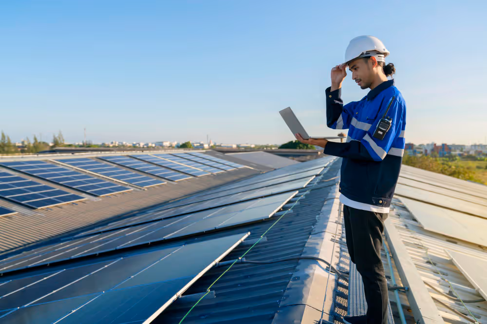A technician on top of solar farm