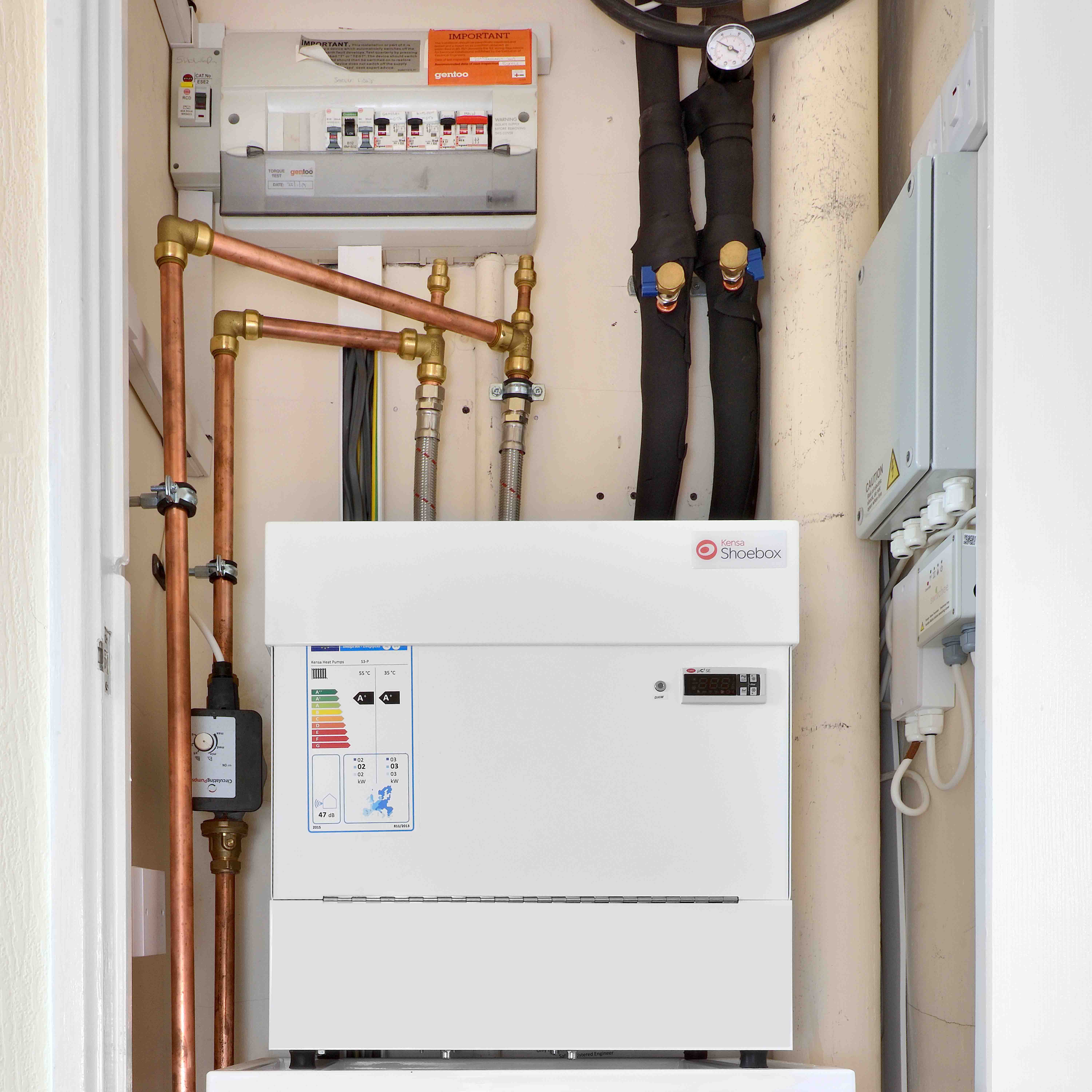 Shared ground source heat pump