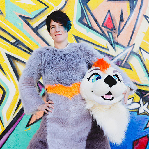 A person wearing a fursuit body and holding the head.