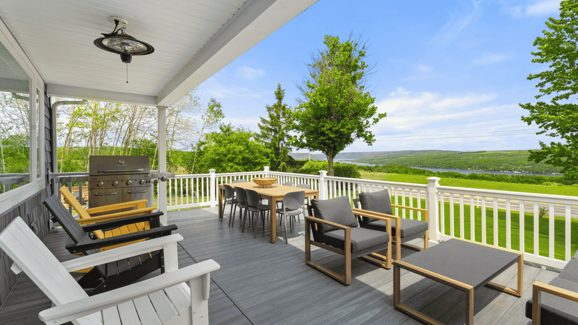 Back deck on a sunny day looking out over a river in the Appalachian foothills