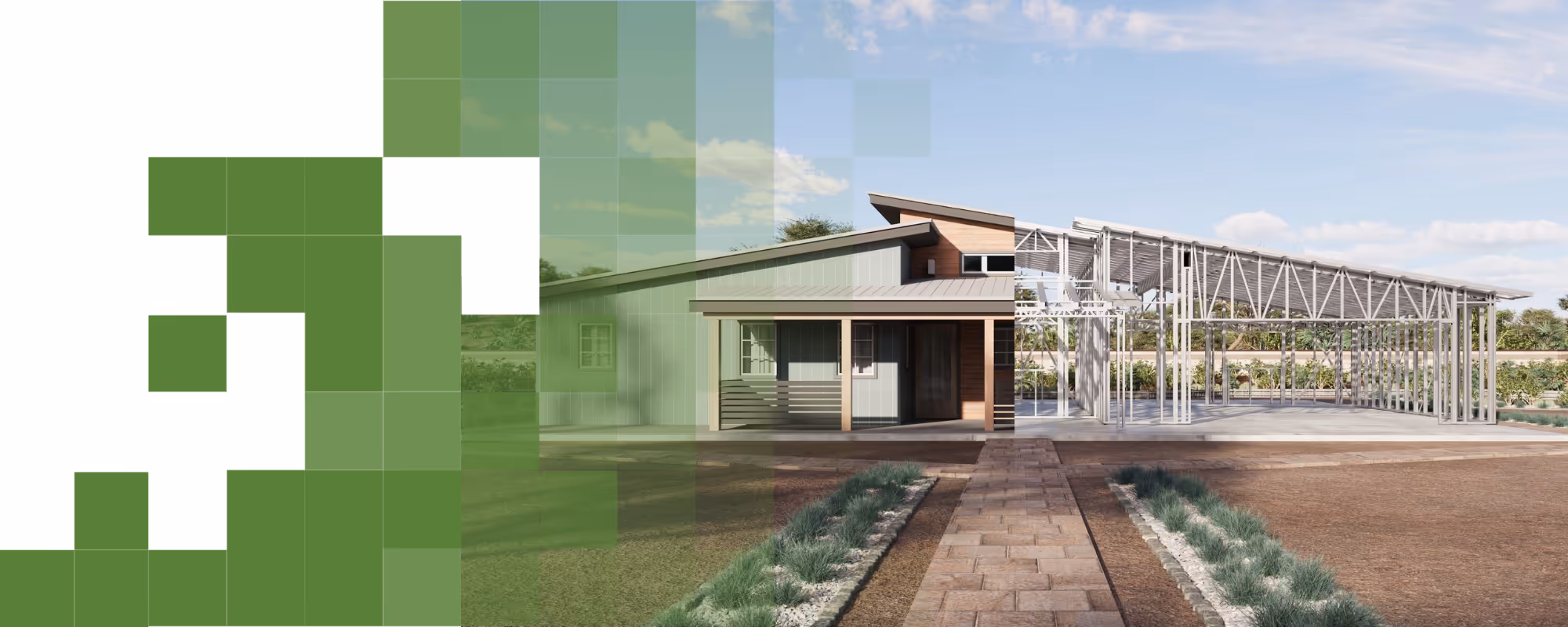 Steel frame structure of a building under construction set against a desert landscape with mountains and blue sky in the background.