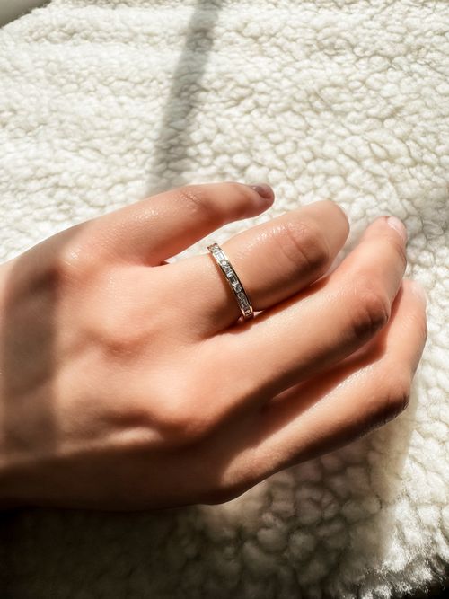 Handcrafted engagement ring with a detailed diamond setting by DERA ADAM, showcasing fine craftsmanship.