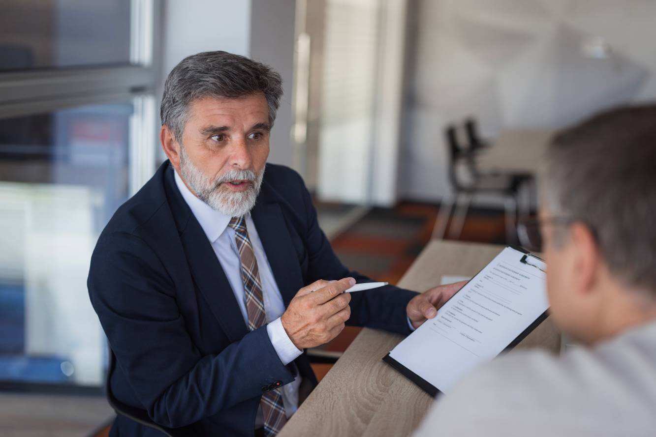 lawyer reviewing independent contractor legal details to small business owner
