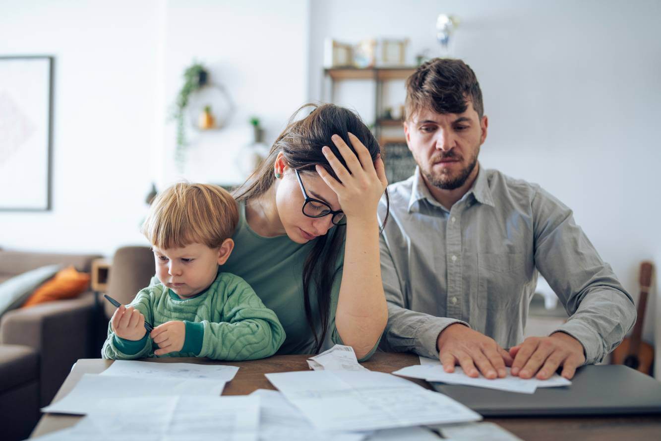 wife holding young son is distraught about possible foreclosure and losing their home