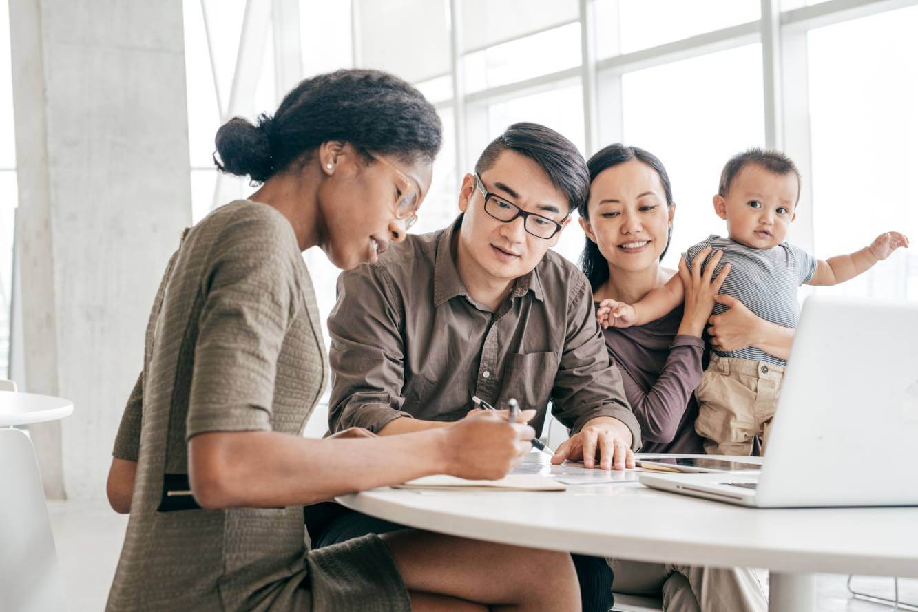 female lawyer working on family's will as they look on