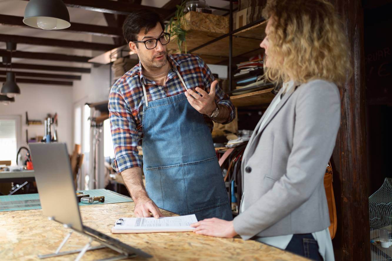 small business owner consulting with lawyer about business registration