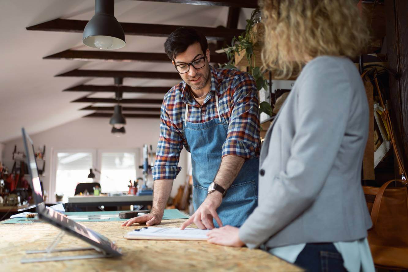 businessman questioning pros and cons of a dba vs llc with lawyer