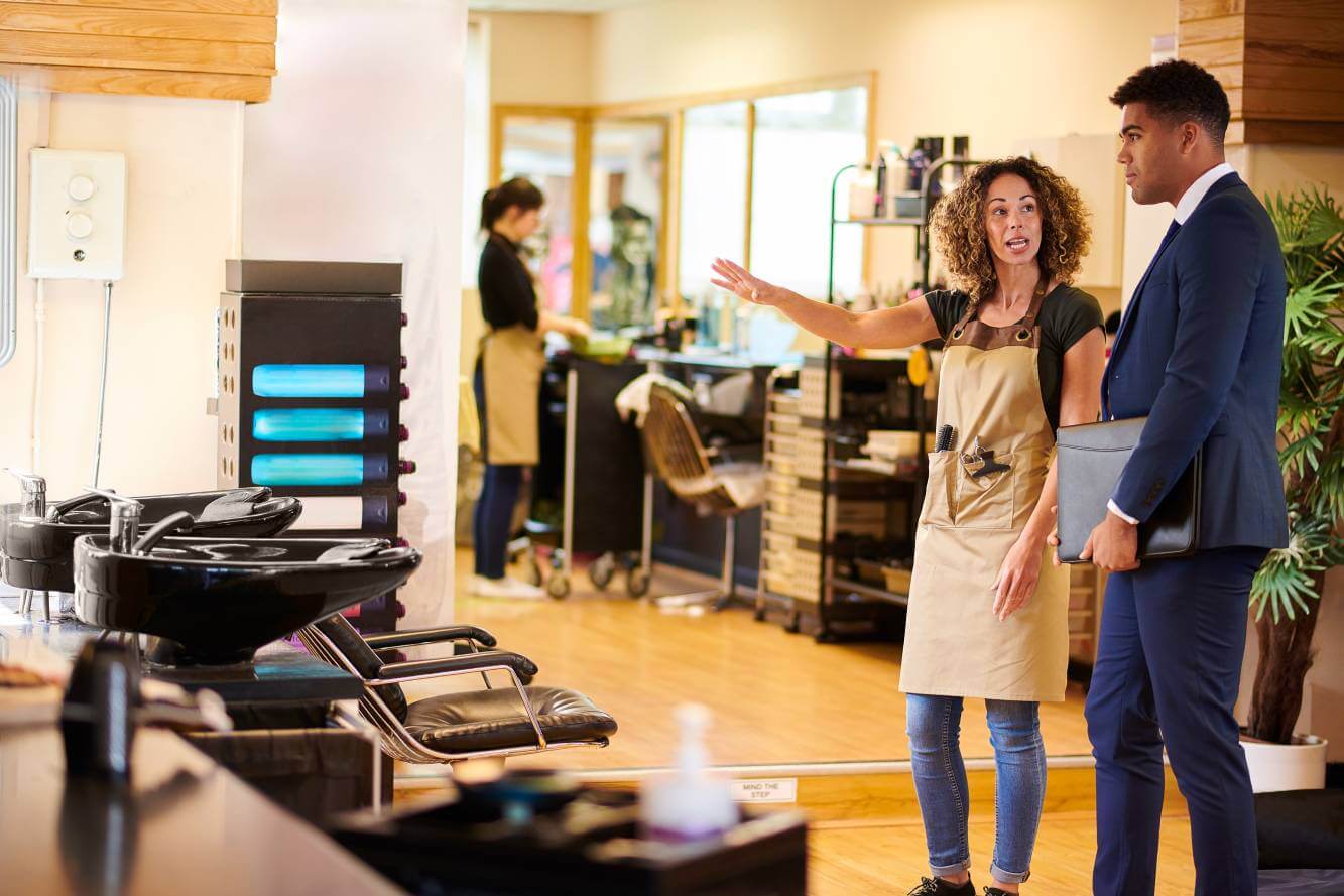 small business owner showing hair salon to her lawyer