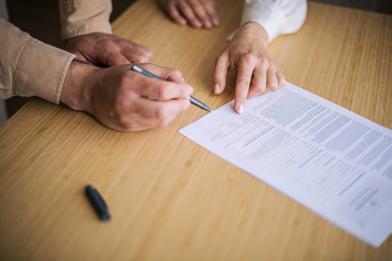 small business lawyer explaining legal document to business owner
