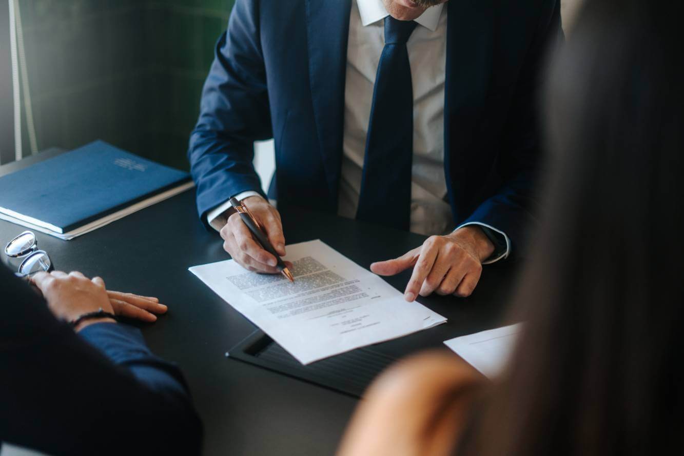 lawyer reviewing estate planning document for family