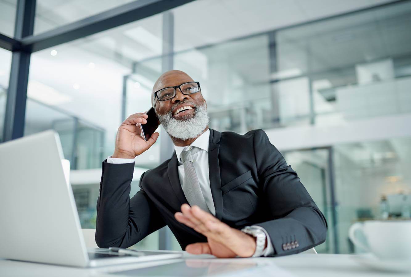 lawyer talking to small business owner on the phone from his office