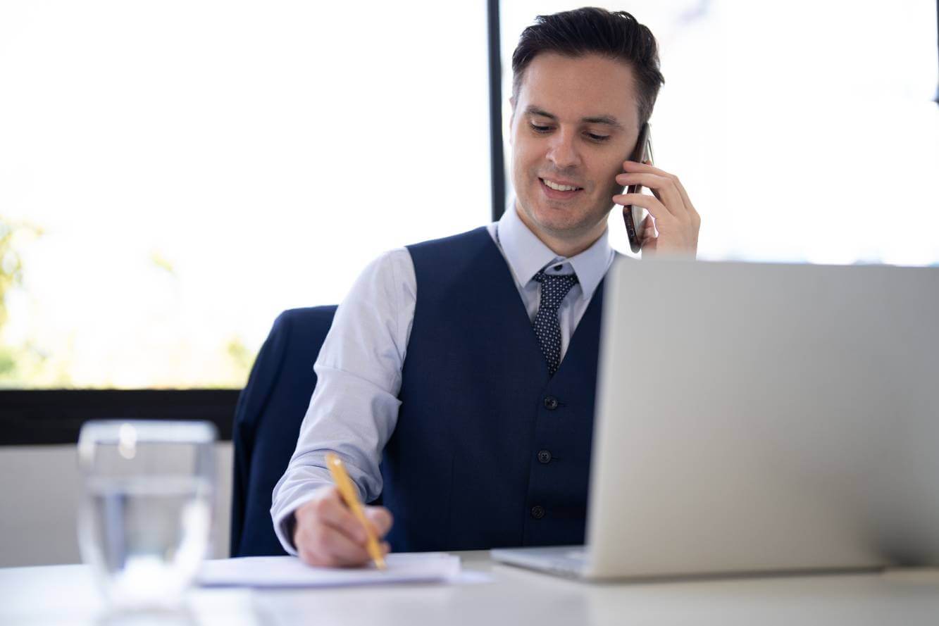 lawyer talking on the phone to client to write a will for a young family